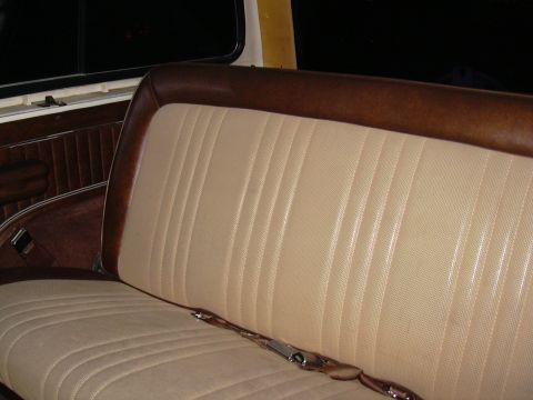 1978 Ford Bronco - Interior view of a bench seat with tan upholstery and brown trim.