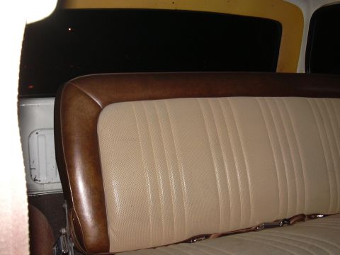 1978 Ford Bronco - Interior view of a 1978 Ford Bronco, focusing on the bench seat and seatbelt.