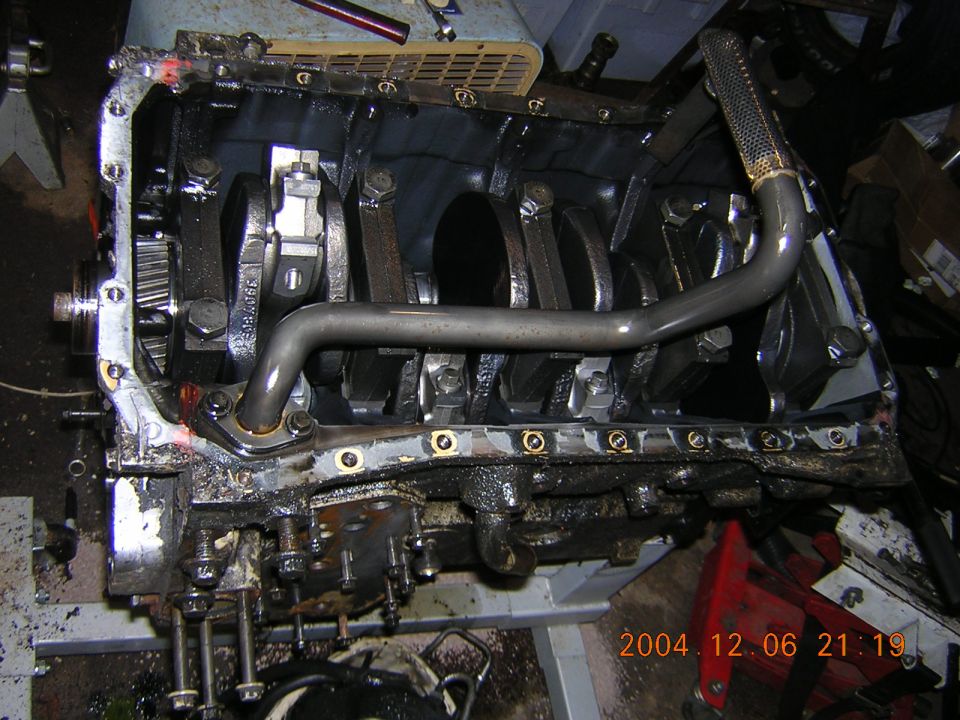 Engine block showing crankshaft, connecting rods, and oil pickup tube. Date stamp 2004.12.06