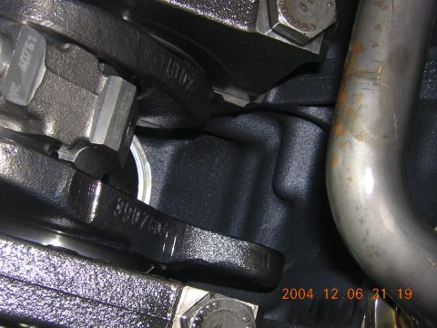 1984 Chevrolet Blazer - Engine block casting shows part number 3907881 next to a section of exhaust pipe.