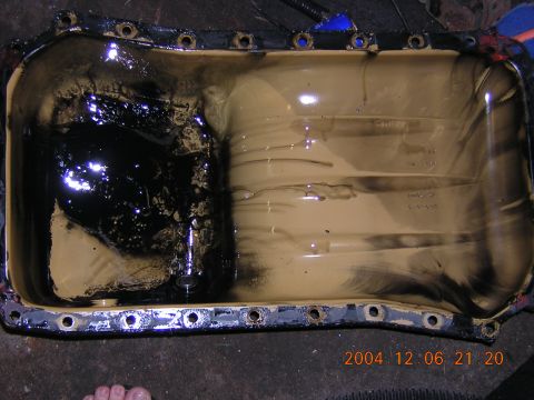 1984 Chevrolet Blazer - This oil pan shows significant sludge buildup, indicating potential maintenance issues.