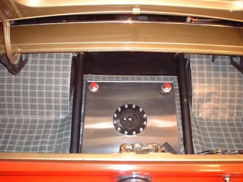 1967 Ford Mustang - Custom fuel cell and roll cage installed in the trunk of a car.