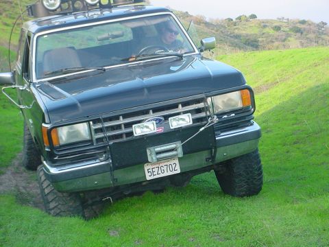 1988 Ford Bronco - This 1988 Ford Bronco is equipped with a winch and roof-mounted off-road lights, ready for adventure.