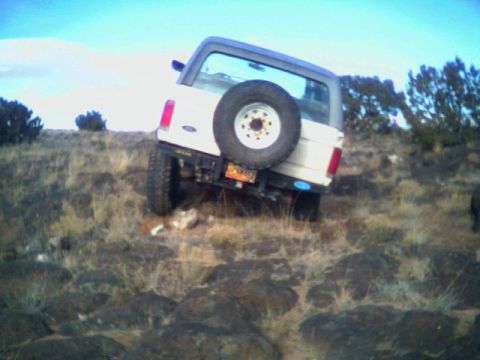 1987 Ford Bronco - This 1987 Ford Bronco is navigating a challenging rocky incline.