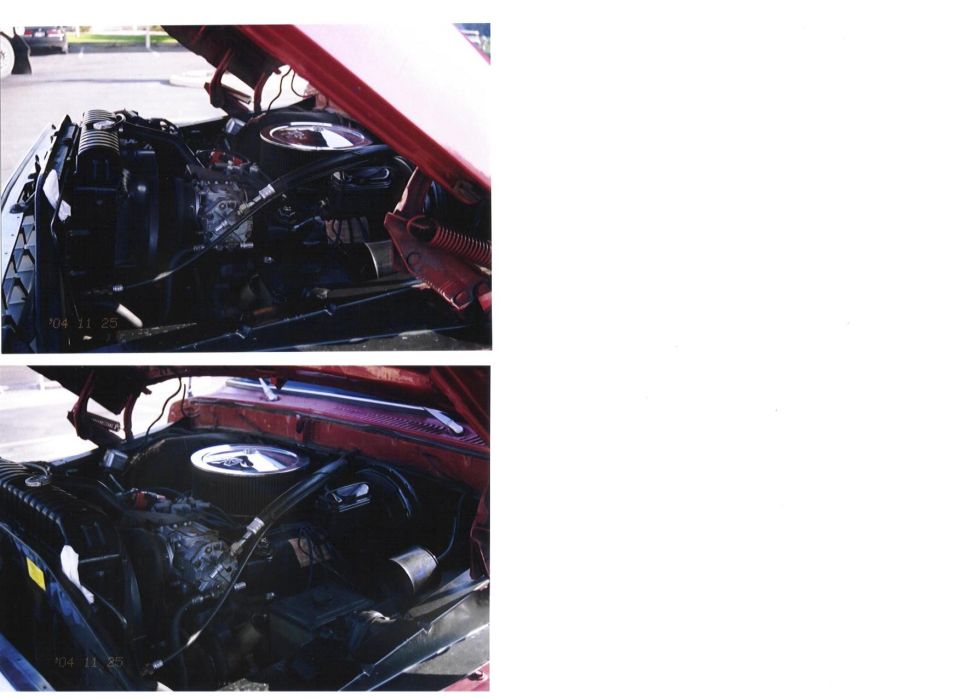 engine bay with hood open, showing engine components and radiator