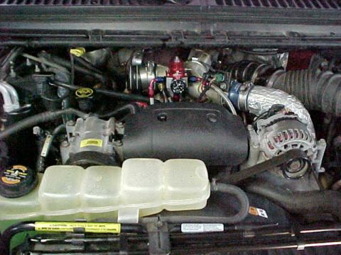 2000 Ford F-250 - Close-up of the engine bay in a 2000 Ford F-250, showing the Power Stroke diesel engine components.