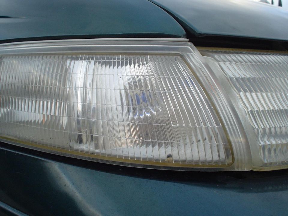 close-up of a car's clear headlight assembly