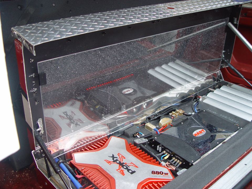 both lids raised to show the amp wiring