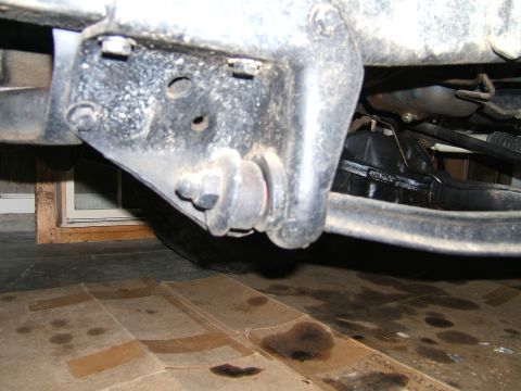 1978 Ford Bronco - Detail shot of the underside of a vehicle, focusing on suspension hardware.