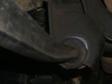 1978 Ford Bronco - A detailed view of a vehicle's suspension system, focusing on a specific component.