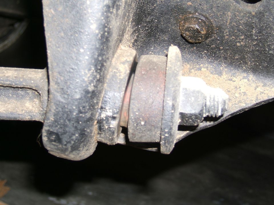 Close-up of a suspension bushing and bolt assembly