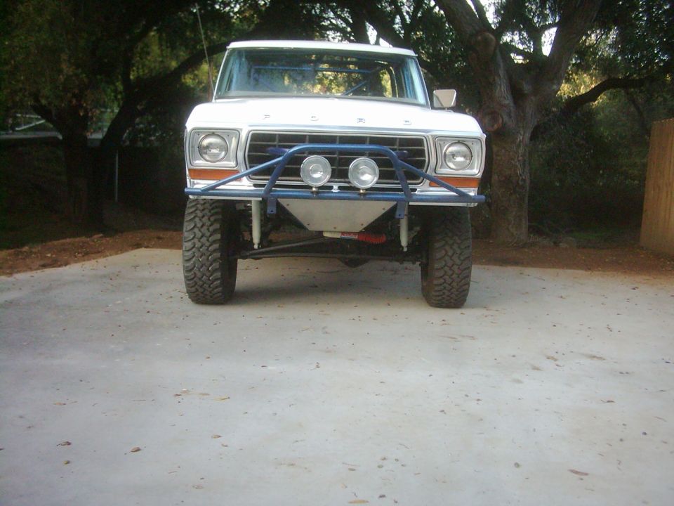 1978 Ford Bronco front view with custom blue off-road bumper and dual spotlights