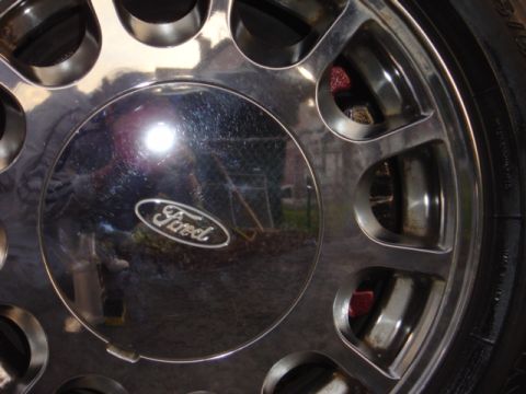 1998 Ford Taurus - Chrome wheel a Ford logo center cap, likely from a truck or SUV.