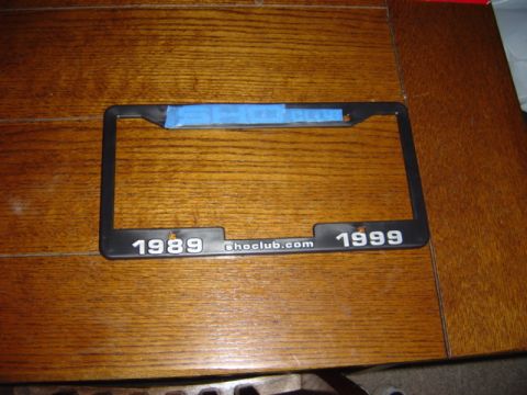 1998 Ford Taurus - A license plate frame with '1989' and '1999' printed on it, along with 'ghoclub.com'.