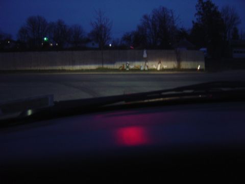 1998 Ford Taurus - Nighttime view from inside a vehicle, showing the dashboard and distant headlights.