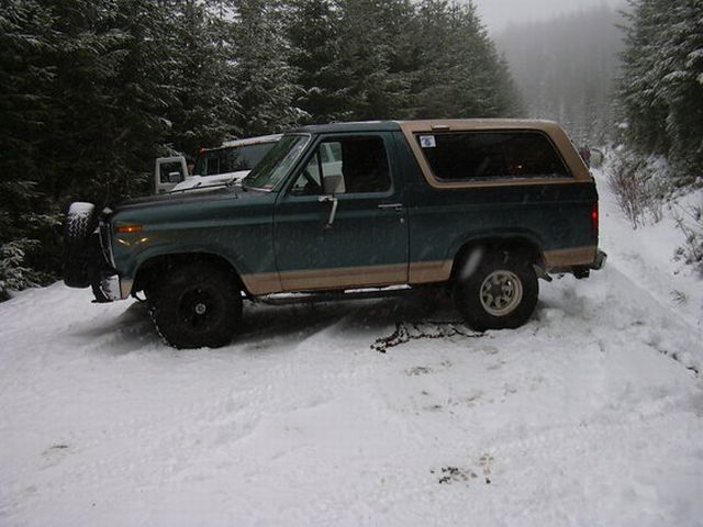 As were were slowly coming down this hill, we hit a patch of ice that was covered by some new fallen snow.  With no way to steer or brake, we slid into the hill side ditch.  Daves Bronco gently slid into mine, drivers side to drivers side... ouch!