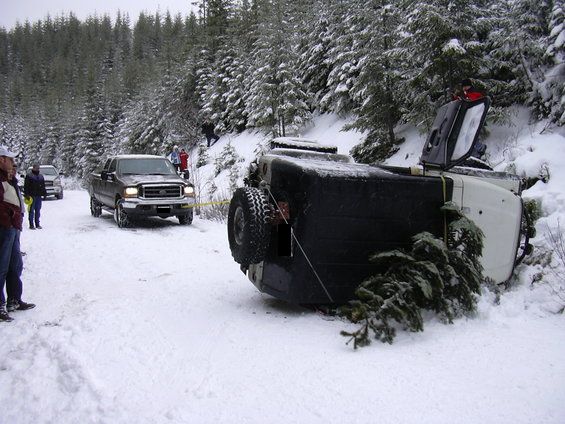 This F350 SuperDuty with chains on all four tires was very impressive as he was able to untangle most of the vehicles and pull Jeffs Jeep back over on its wheels.  Mikes Bronco with winch was instrumental in getting Jeffs Jeep back over on its wheels as well.