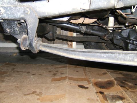 1978 Ford Bronco - Close-up of the vehicle's undercarriage, showing suspension and drive shaft components.
