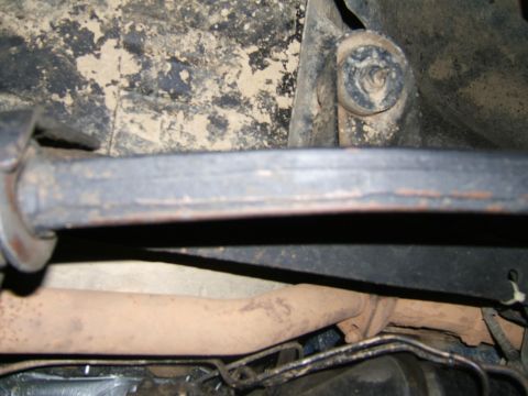 1978 Ford Bronco - Close-up view of the undercarriage of a vehicle, revealing exhaust and suspension parts.