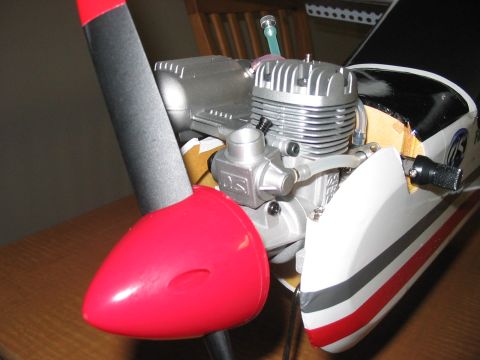 1988 Ford Bronco - Close-up view of a model airplane's engine and propeller assembly, with visible branding on the fuselage.