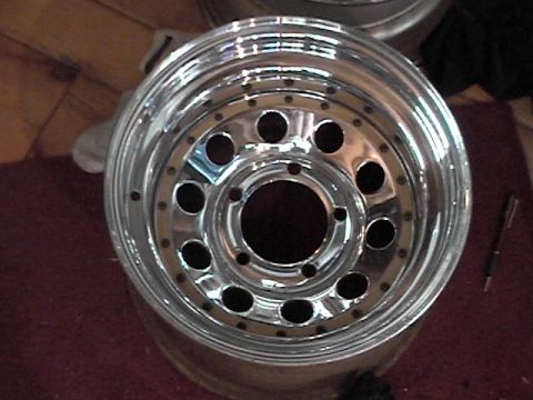 1995 Ford Bronco - Close-up of a shiny chrome alloy wheel, likely for an older truck or SUV.