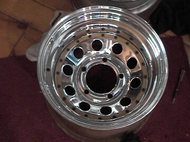 Chrome alloy wheel with multiple lug holes and a polished lip