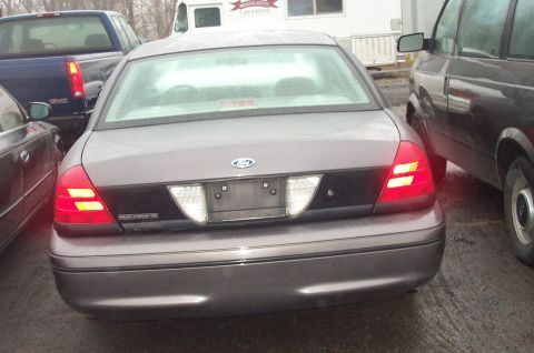 1991 Ford LTD Crown Victoria - Rear view of a gray Ford Crown Victoria, showing its taillights and Ford emblem.