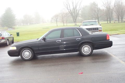 1991 Ford LTD Crown Victoria - This 1991 Ford Crown Victoria LTD is seen from the side on a foggy day.