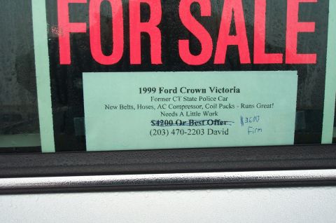 1991 Ford LTD Crown Victoria - Photo of a handwritten For Sale sign in a car window, not a technical document.