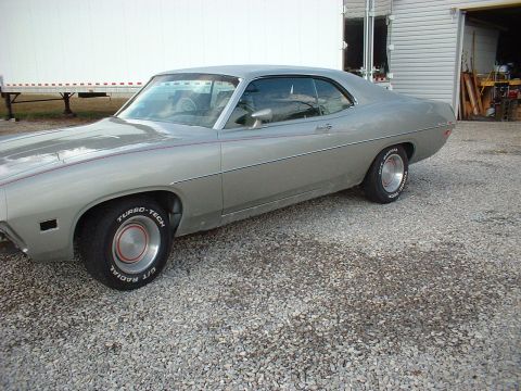 1971 Ford Torino - This 1971 Ford Torino coupe features a silver paint job with a subtle red pinstripe accent.