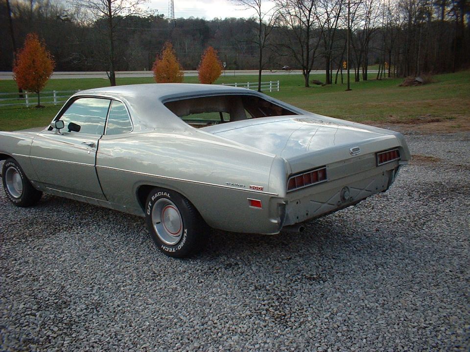 1971 Ford Torino coupe, rear 3/4 view, silver paint, missing rear bumper