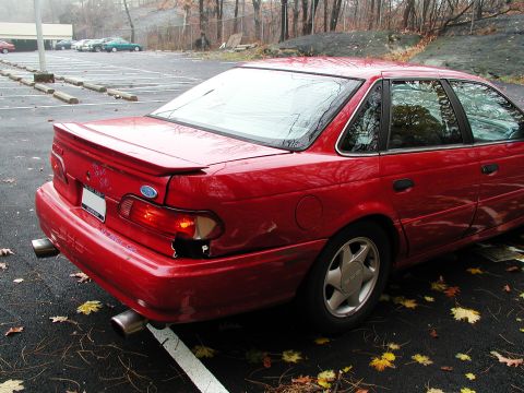 1992 Ford Taurus - This 1992 Ford Taurus shows damage to its rear passenger side taillight and bumper.