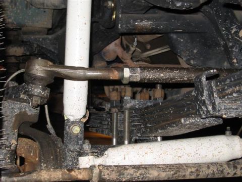 1994 Ford Bronco - Undercarriage view showing steering components and suspension parts, with a Supermotors.net watermark.