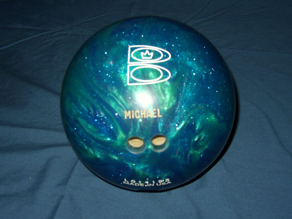 Blue and green swirled bowling ball with white logo and name MICHAEL