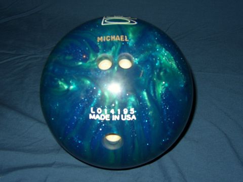 1987 Volkswagen Golf - A bowling ball with "MICHAEL" and "L014195. MADE IN USA" is shown against a dark blue background.