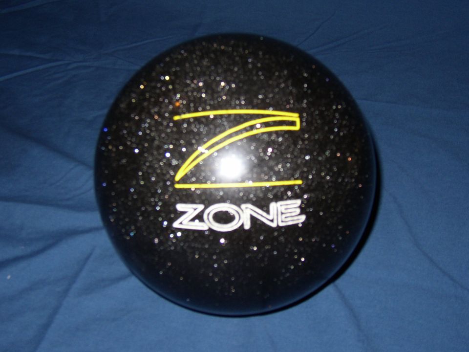 Black bowling ball with yellow Z logo and white 'ZONE' text