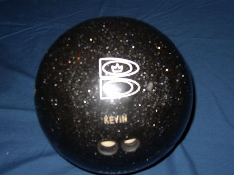1987 Volkswagen Golf - This black bowling ball features a white logo and the name KEVIN visible on its surface.