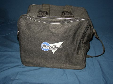 1987 Volkswagen Golf - A black duffel bag with the Excalibur logo is shown against a blue background.