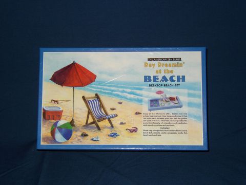 1987 Volkswagen Golf - Packaging for a desktop beach set depicts a relaxing beach scene with various accessories.