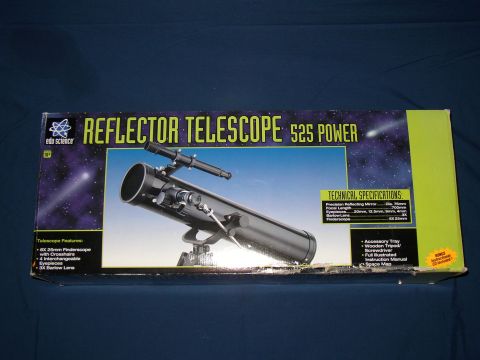 1987 Volkswagen Golf - The box displays a reflector telescope and lists its features and technical specifications.