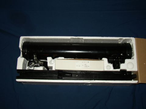 1987 Volkswagen Golf - A black telescope is packed in its original box with accessories, ready for shipping or storage.