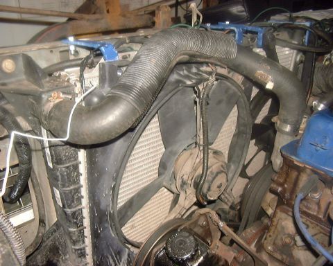 1985 Ford F-150 - Close-up view of a vehicle's engine bay, focusing on the cooling system components.