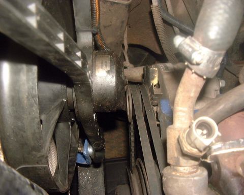 1985 Ford F-150 - Engine bay view showing fan, belts, and associated components.