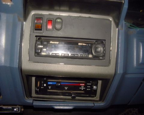 1985 Ford F-150 - Interior view of a car's dashboard, displaying an aftermarket stereo and climate control unit.