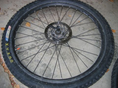1995 Ford Bronco - A close-up view of a bicycle wheel a Geax tire and a disc brake rotor.