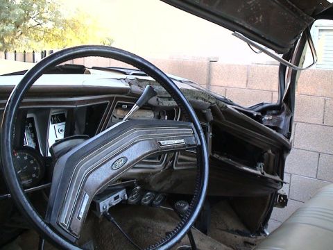 1979 Ford Bronco - Driver's-side interior of an older Ford truck with the windshield removed and the top open, showing the black two-spoke steering wheel, For…