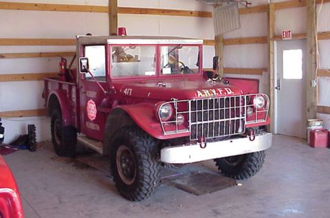 1973 Ford F-250 - This red fire truck, marked A.R.N.F.D., is parked inside a garage.