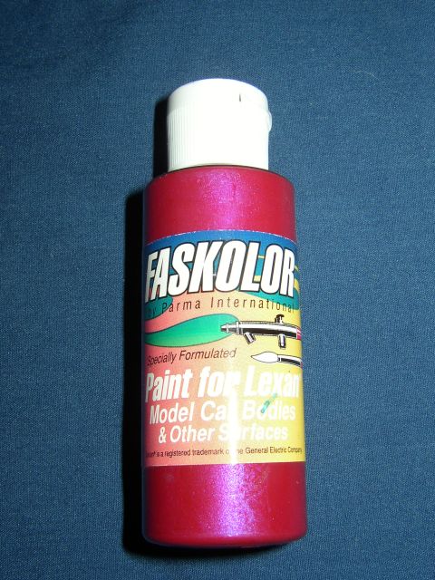 1987 Volkswagen Golf - A bottle of Faskolor paint for model car bodies is shown against a dark blue background.