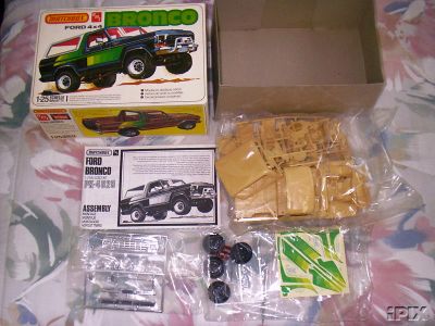 1979 Ford Bronco - This is a Matchbox 1:25 scale model kit of a Ford Bronco, including the box art, assembly instructions, and all plastic parts.