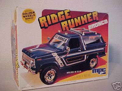 1979 Ford Bronco - Photo of an MPC "Ridge Runner Bronco" model kit box, with box art of a blue open-top Bronco with white stripes, roll bar with light bar, br…